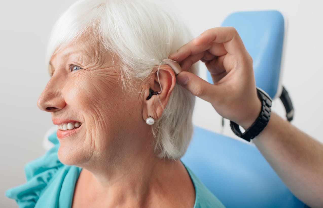 Adjusting of a hearing aid for a senior woman